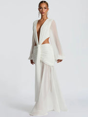 Woman wearing an elegant formal dress for sunset events and rooftop soirées on a white background