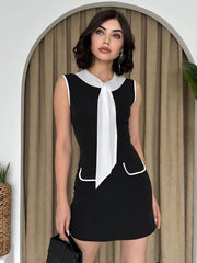 Elegant sleeveless stretch mini dress with tie detail