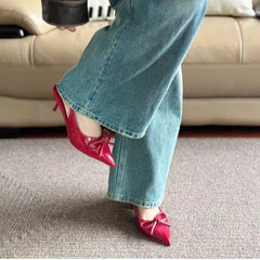 Elegant open-toe red heels with bow detail