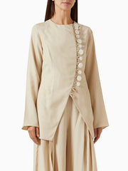 A full-length shot of an elegant women's jacket, styled for a day at the office.