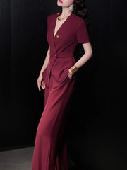 A full-length shot of an elegant women's two-piece set, styled for a day at the office.