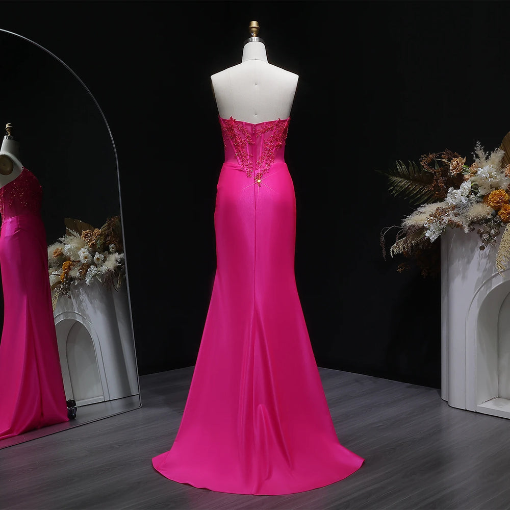 Close-up of appliqué bodice detail on satin mermaid gown