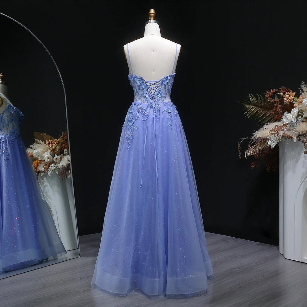 Close-up of sequin appliqué bodice detailing on layered tulle gown