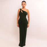 Emerald green one-shoulder gown styled for evening events