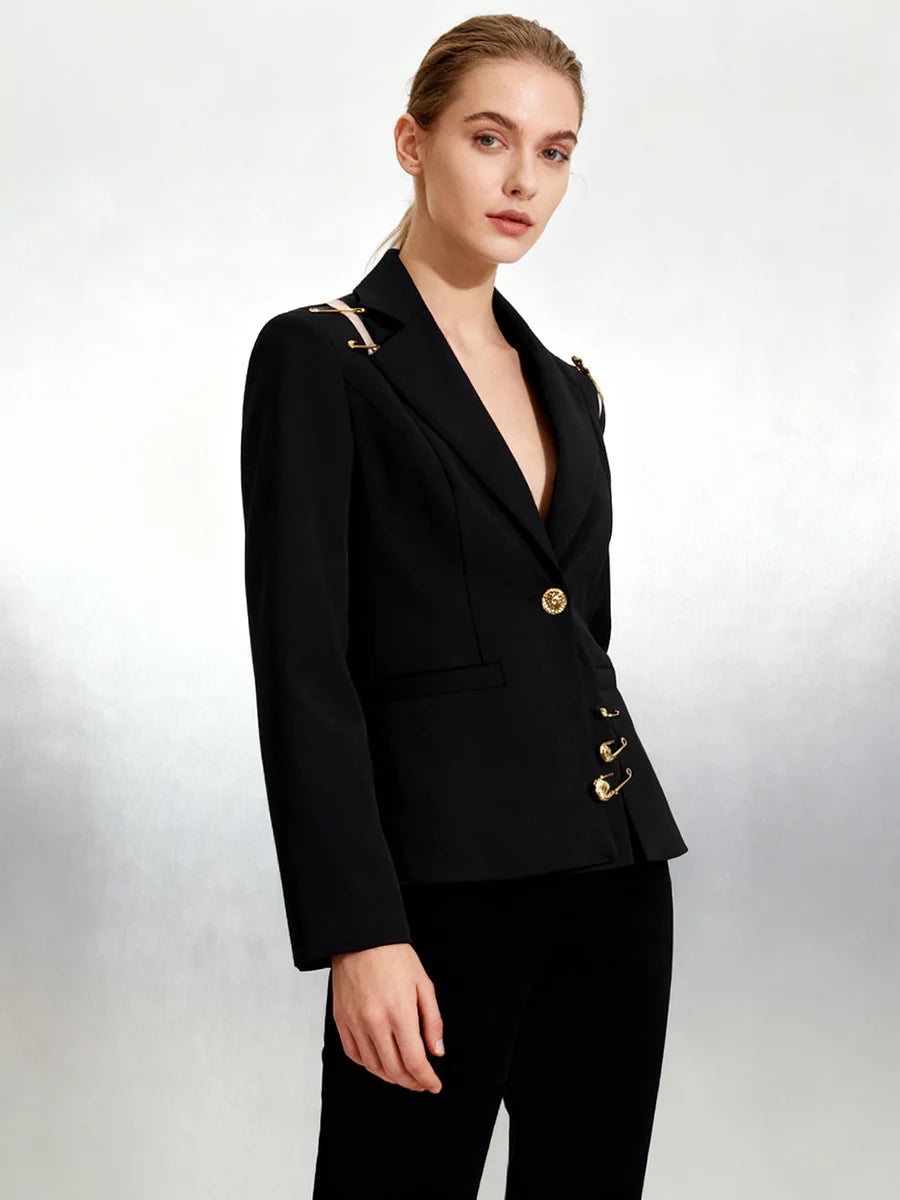 Structured black blazer styled with gold design elements