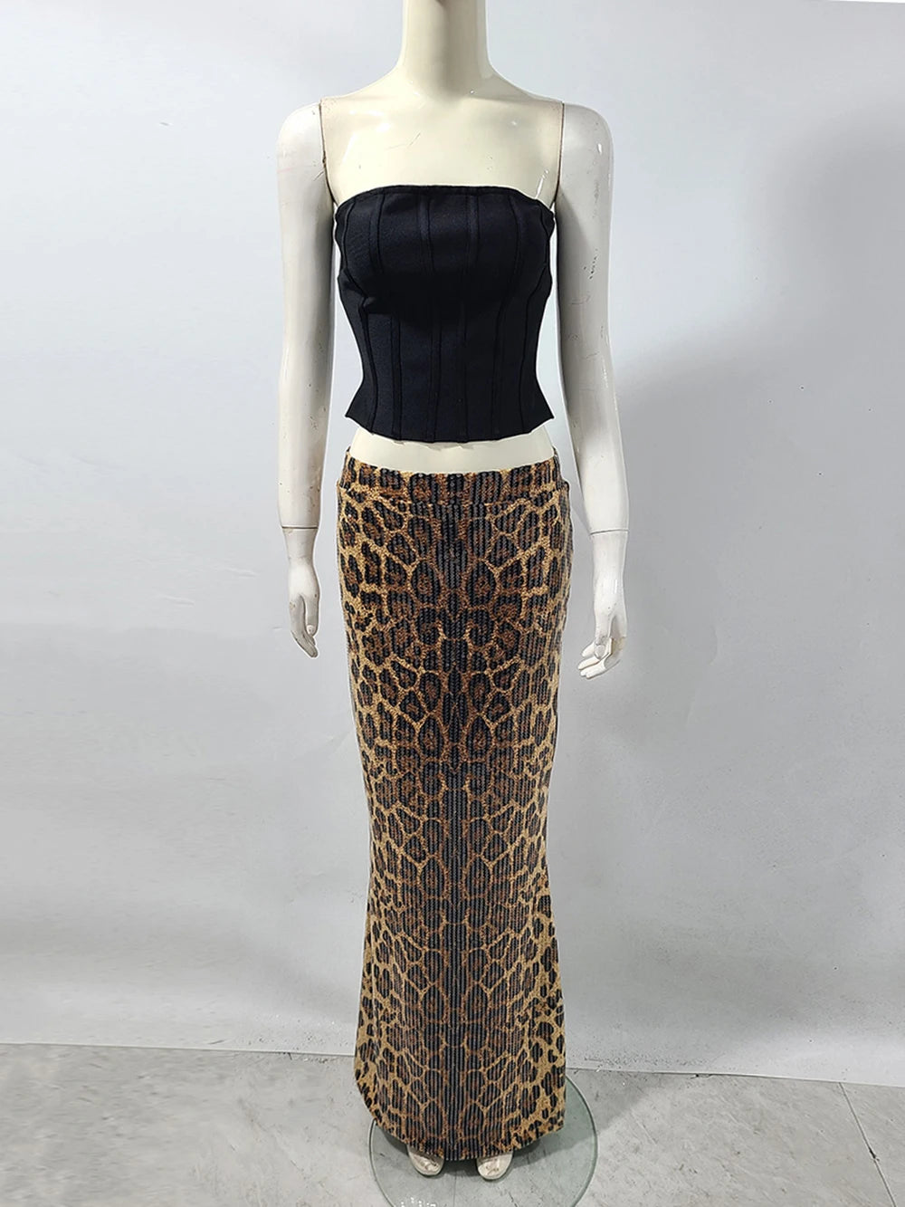 Mannequin shot of two-piece evening set featuring black corset and leopard sequin skirt