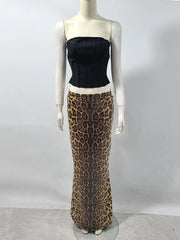 Mannequin shot of two-piece evening set featuring black corset and leopard sequin skirt