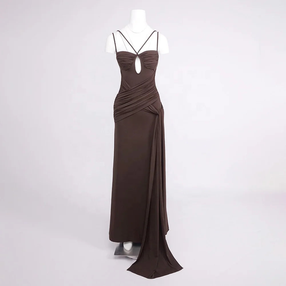 Formal gown with strappy neckline, sculpted drape, and slit opening