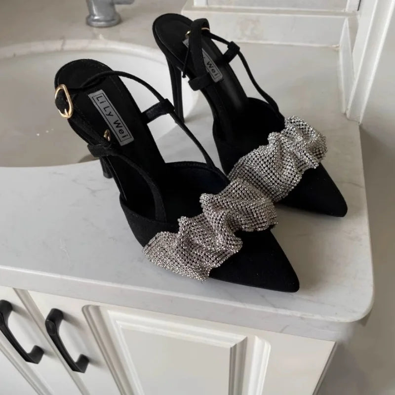 Black slingback heels paired with evening jumpsuit for a bold fashion accessory