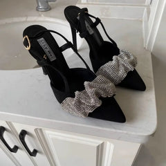 Black slingback heels paired with evening jumpsuit for a bold fashion accessory