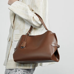 Minimalist split leather handbag styled for versatile use