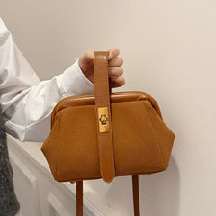 Faux suede frame bag with top strap detail and hasp closure