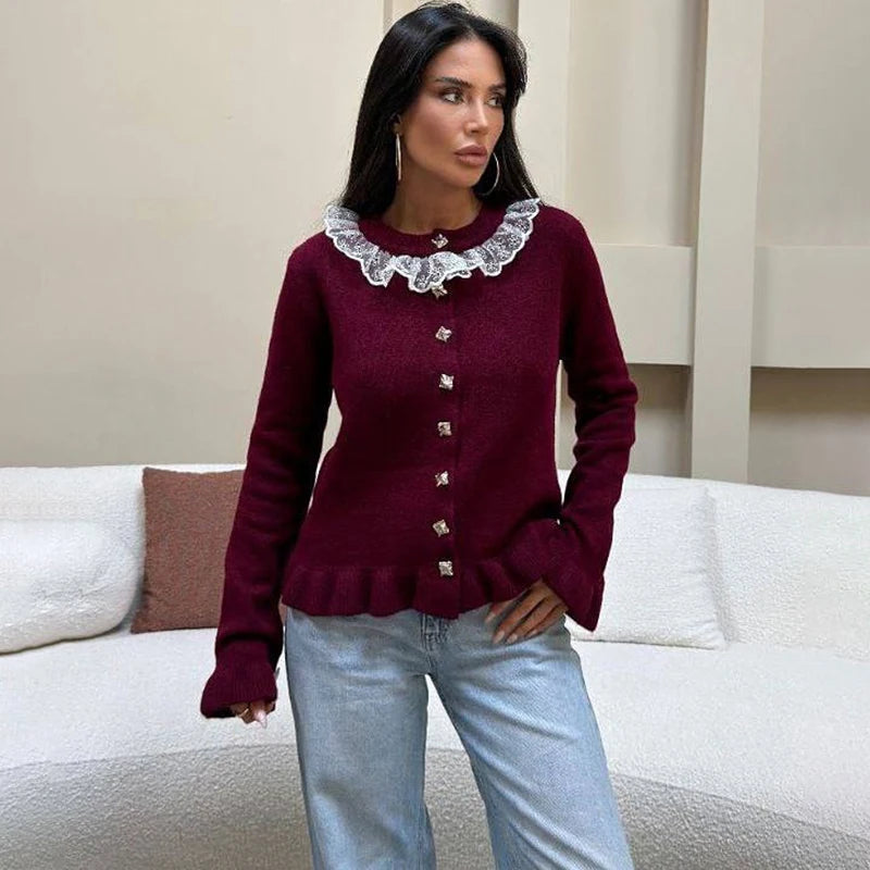 Close-up of lace collar and button detailing on a feminine knit cardigan