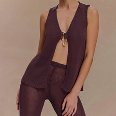 Gold clasp festival layering vest styled for warm weather looks