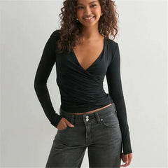 Fitted white layering tee paired with denim for classic minimal style