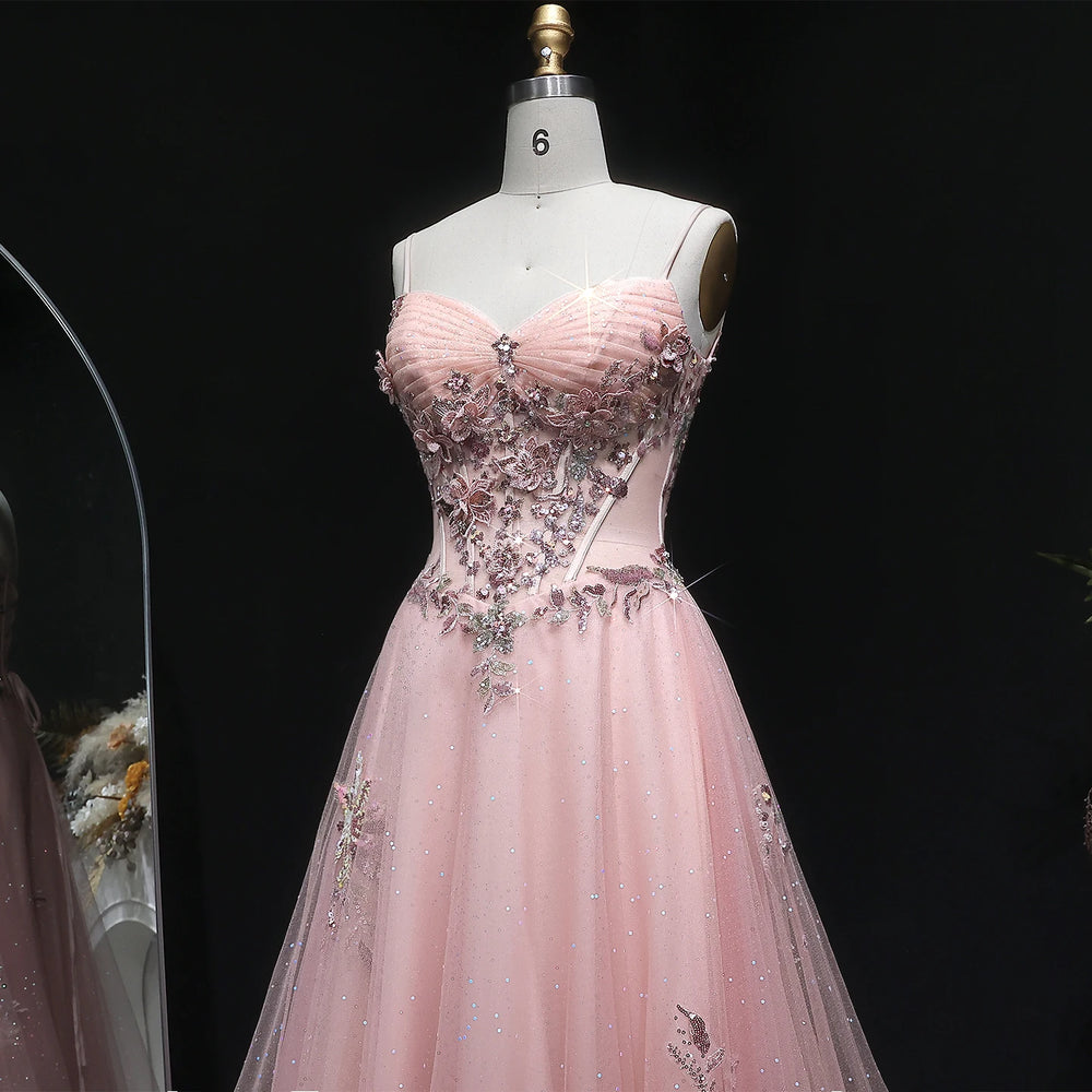 Formal tulle gown with embellished bodice and softly draped full skirt