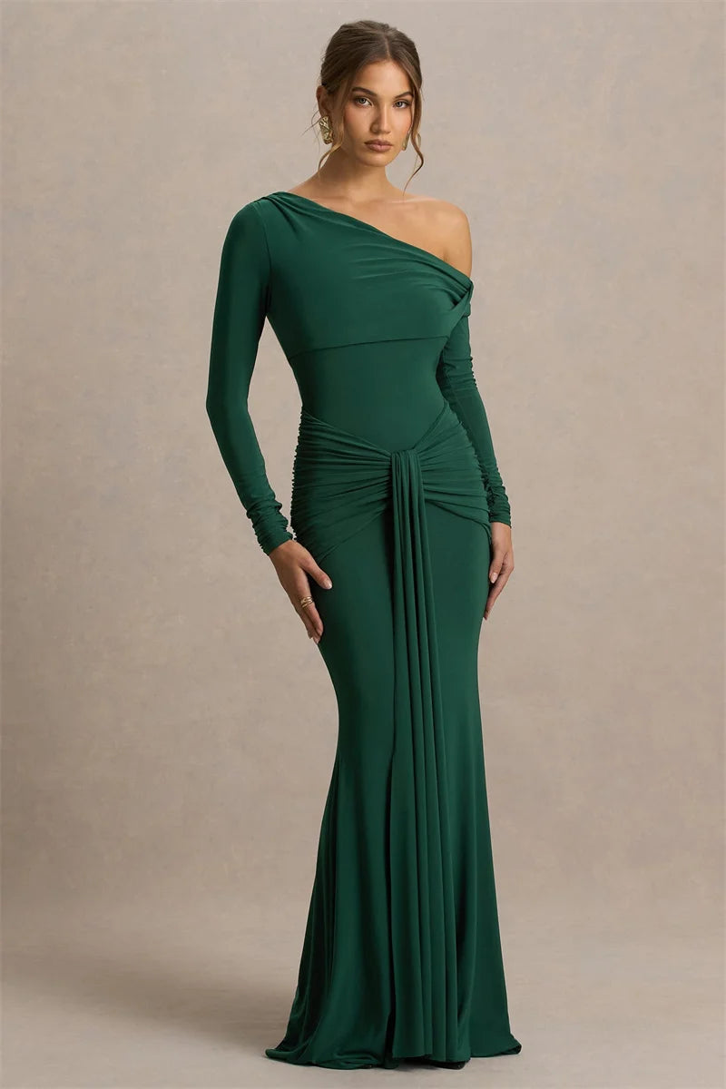 Full-length view showing the gown’s fluid hem and sleek fit, styled with minimal accessories for a formal evening look.