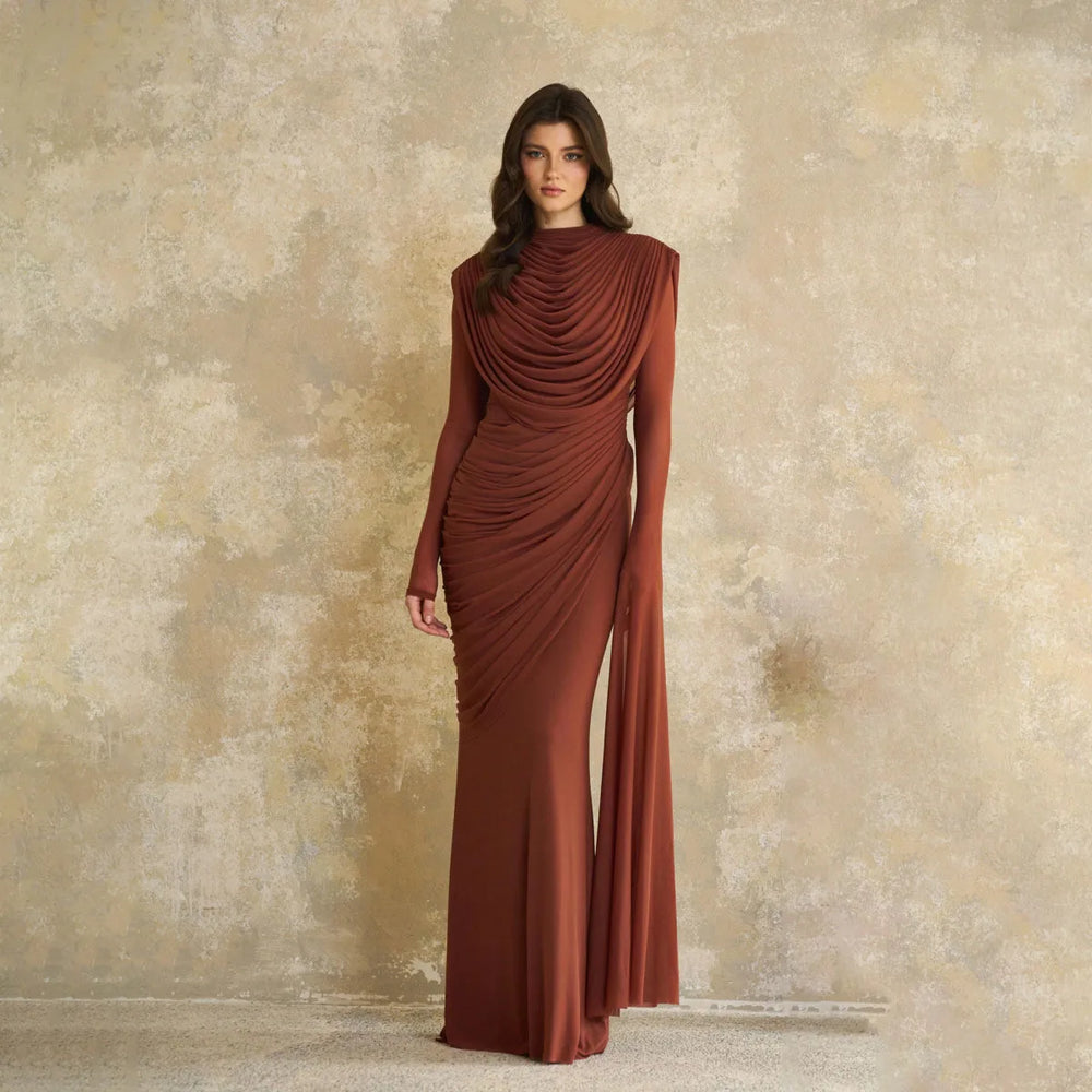 Full-length view of the relaxed A-line maxi gown, featuring long sleeves and a smooth skirt fall designed for formal occasions.
