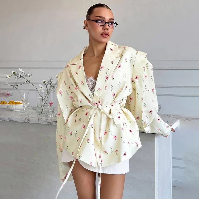 Feminine floral blazer with shoulder pads styled with lace top