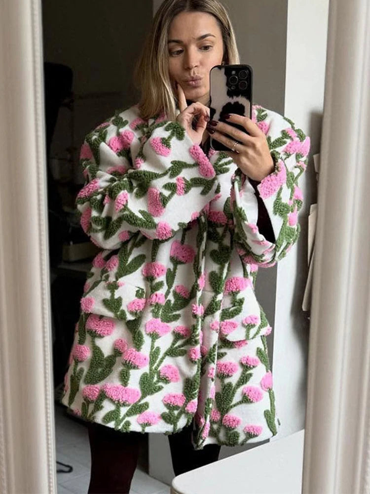 Close-up of the fleece surface and floral appliqué texture, showing the raised pattern and soft, cozy finish.