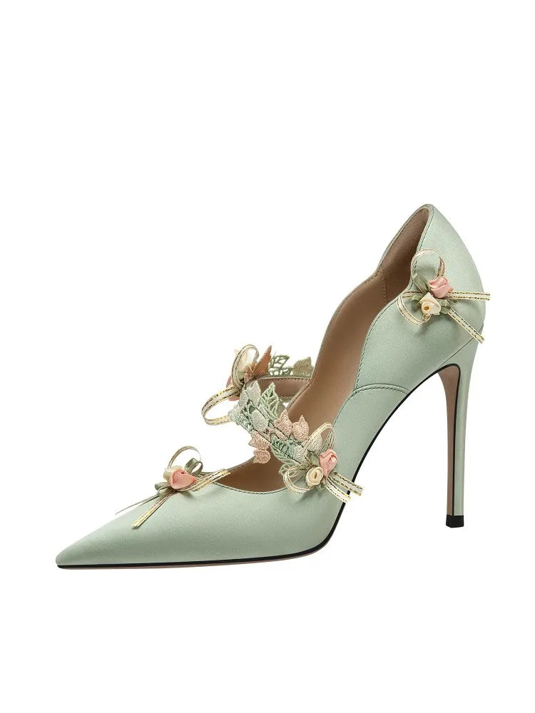 Mint green high heel shoe with handmade flower lace and bow, perfect for party or wedding on a white background
