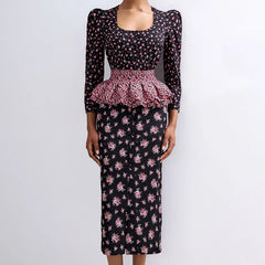 Front view of floral midi dress with peplum waist and long sleeves