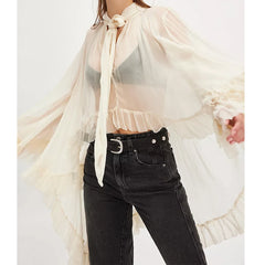 Semi-sheer pullover blouse designed for layering with a refined finish
