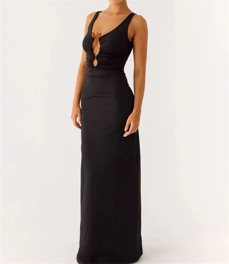 Lower-half detail showing the smooth drape and flow of the black maxi hemline as it falls straight to the floor.