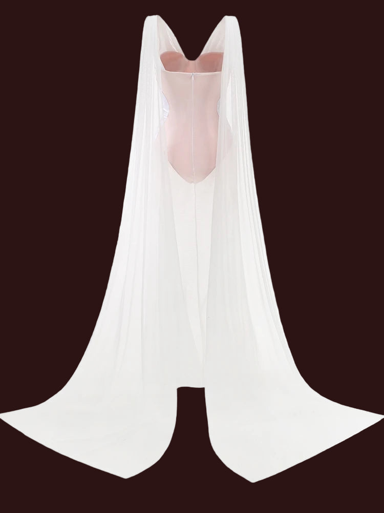 Modern white formal winter maxi dress for special events. White sleeveless top with a V-neck on a white background