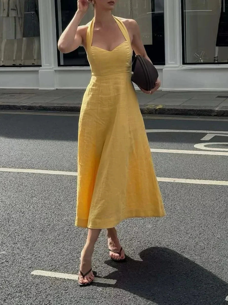 Backless French-inspired dress in bright yellow for warm days
