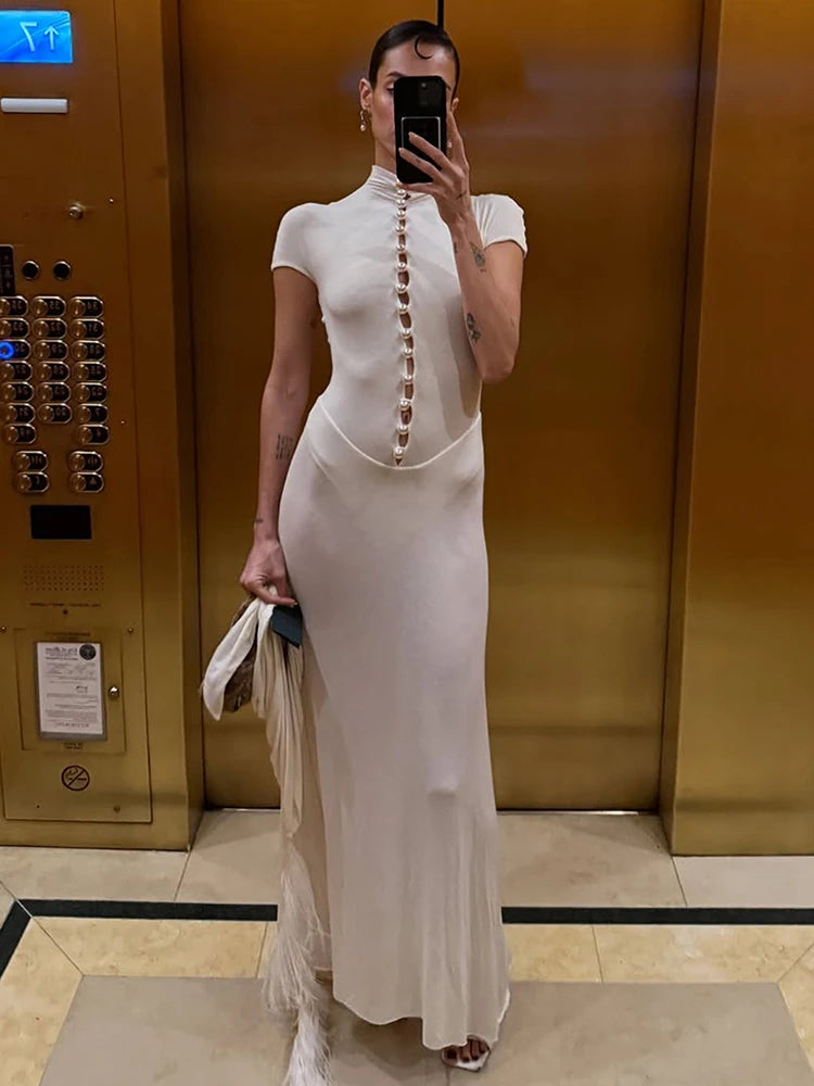 Front view of an ankle-length evening dress with bead detailing