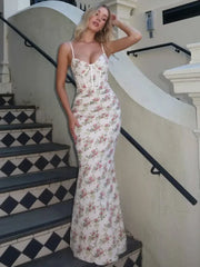 Full-length slim fit floral dress styled for an outdoor event