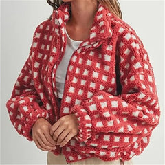 Red and white checkered fleece jacket worn by a person on a light gray background