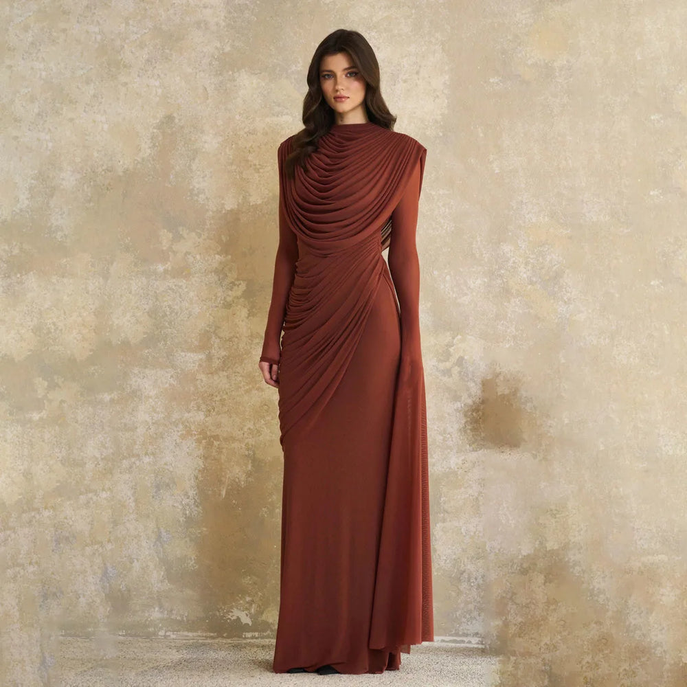 Close-up of the gathered drape at the high neckline, showing soft layered folds that frame the chest with sculpted elegance.