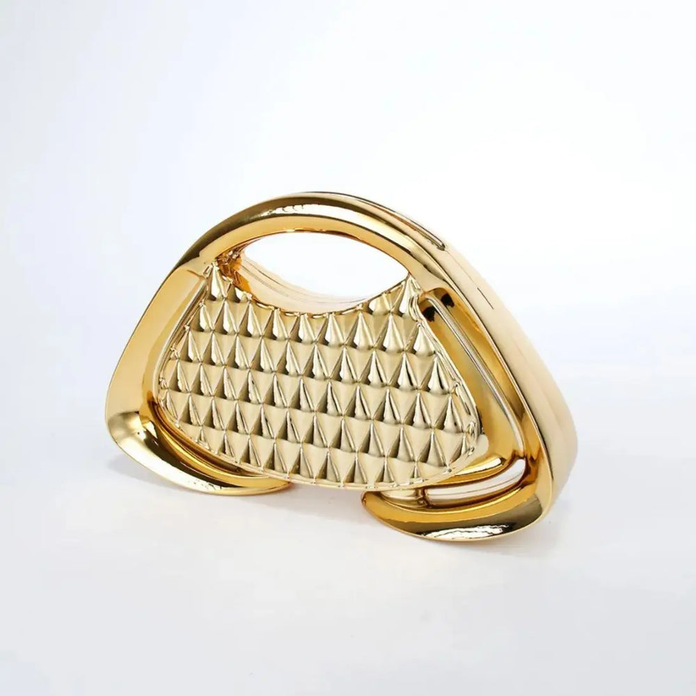 Close-up of geometric detailing on glossy acrylic evening clutch