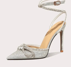 Rhinestone embellished bow sandals for evening wear