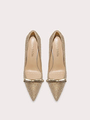 Gold glitter bow pointed pumps styled for party celebrations
