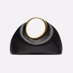 Gold ring black hobo clutch bag styled for art-inspired evening outfits