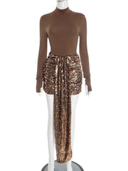 Mannequin wearing a brown turtleneck top and sequin skirt on a white background