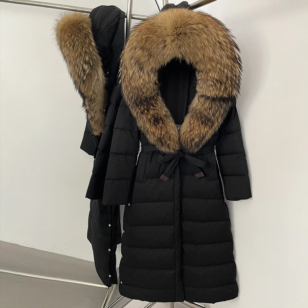 Belted waist detail on a long quilted puffer, highlighting the adjustable tie and clean, streamlined shaping through the body.