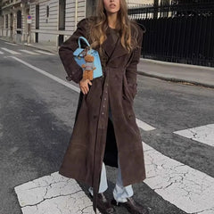 Street-style outfit featuring a coffee A-line trench coat