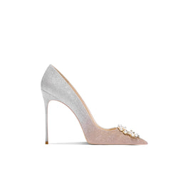Silver high-heeled shoe with decorative elements on a white background