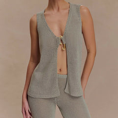 Gray knit tank vest with gold clasp styled for summer and city layering