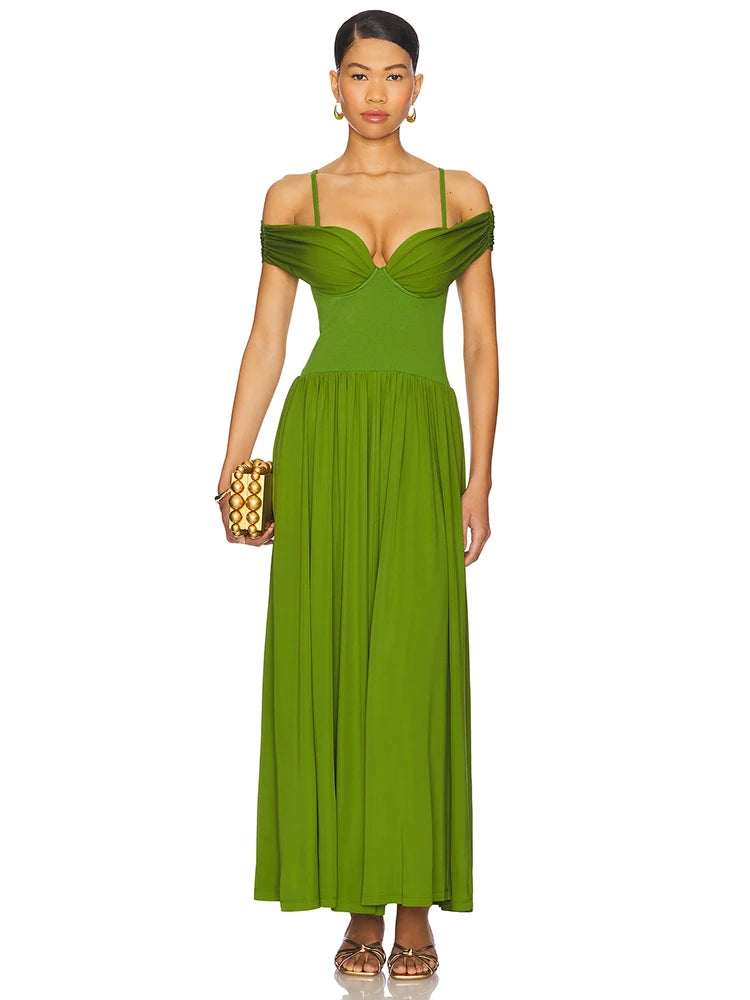 Woman wearing a green off-shoulder pleated maxi dress for formal and evening occasions with a white background