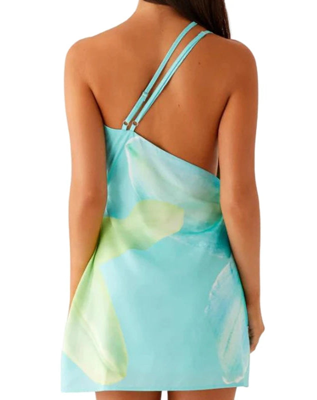 Back side of a woman wearing a resort-ready backless dress styled for summer vacations with thin straps on a white background .