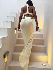 Women climbing a stair ,back view of floor-length mesh skirt and top combo .