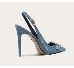 A front view of a high-heel pump, highlighting the thin heel and elegant design.