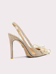 A front view of a high-heel sandal, highlighting the thin heel and elegant design.
