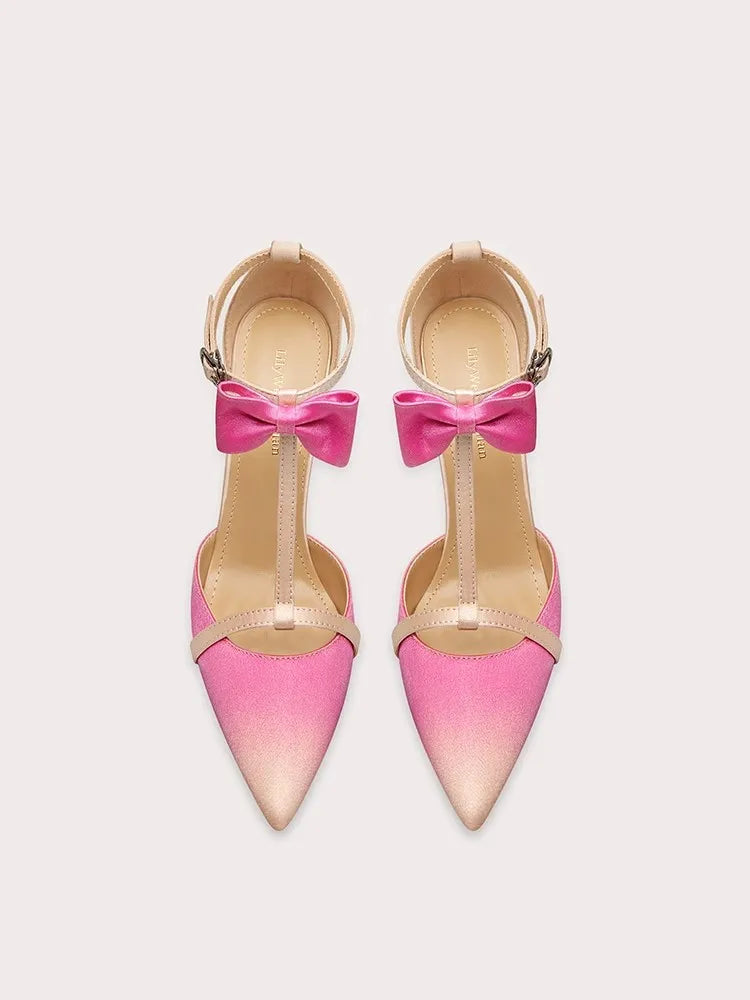 A front view of a high-heel sandal, highlighting the thin heel and elegant design.