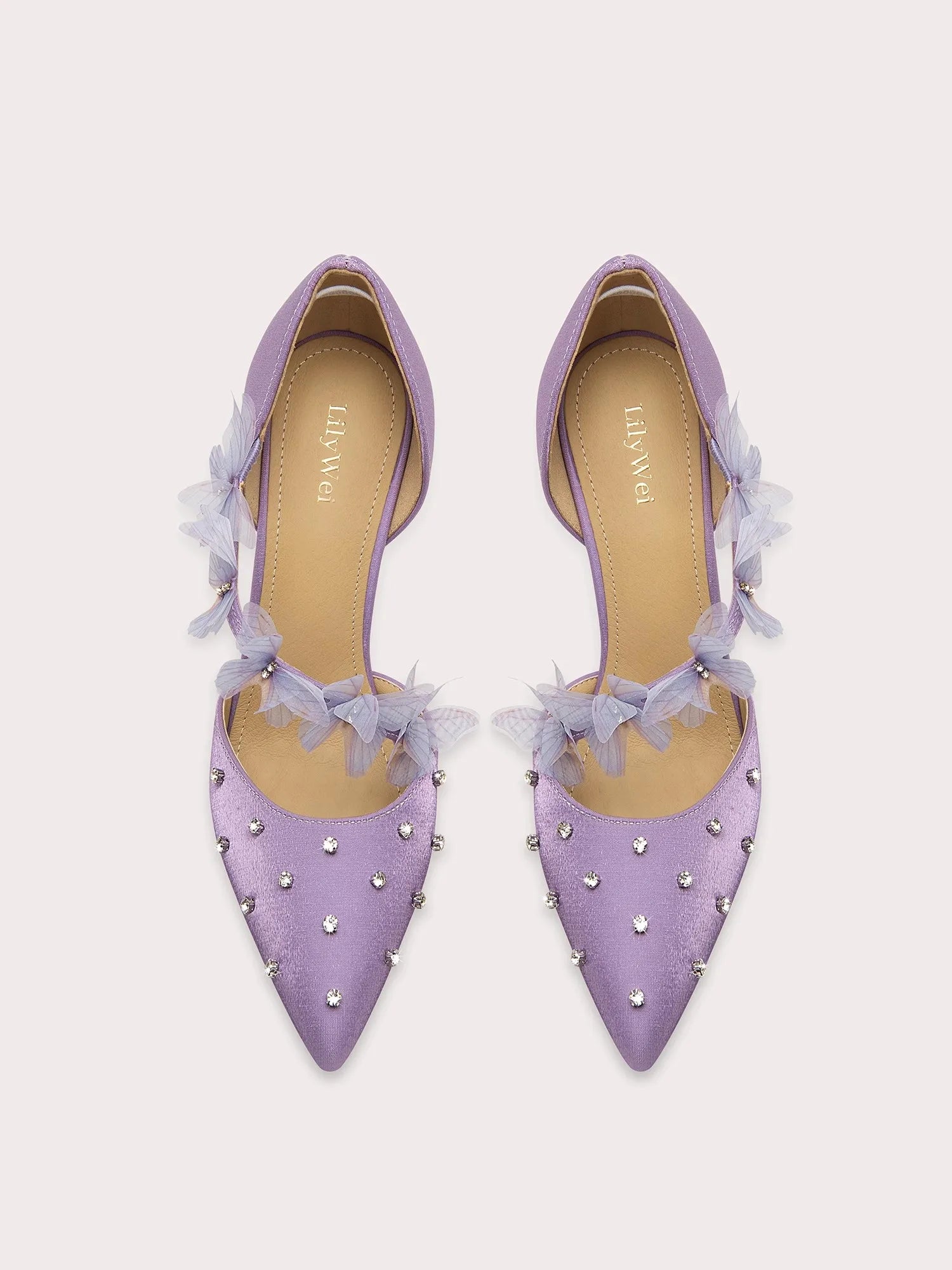 A front view of a high-heel sandal, highlighting the thin heel and elegant design.